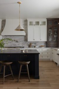 large kitchen with marble back splash and real silver styling