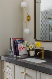 playful kids bathroom with colorful books and bright yellow flowers