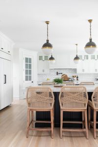 farmhouse kitchen, rattan kitchen chairs, black and white pendants, kitchen design